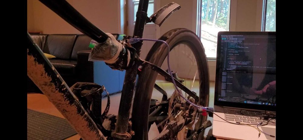 arduino wired onto a bike with computer screen